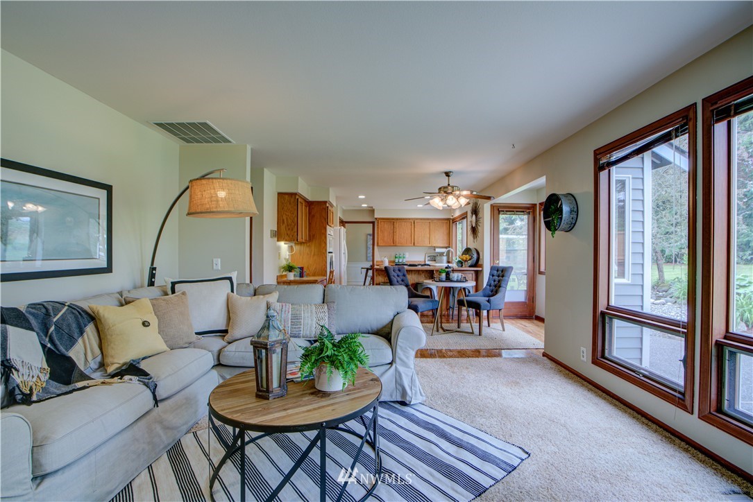 18322 Bellflower Road Bothell, WA 98012 - Photo 20 of 34 a living room with furniture and a large window