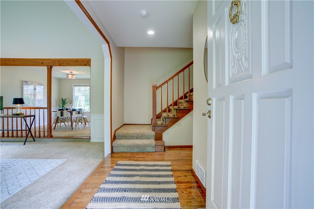 18322 Bellflower Road Bothell, WA 98012 - Photo 25 of 34 a view of entryway and hall with wooden floor