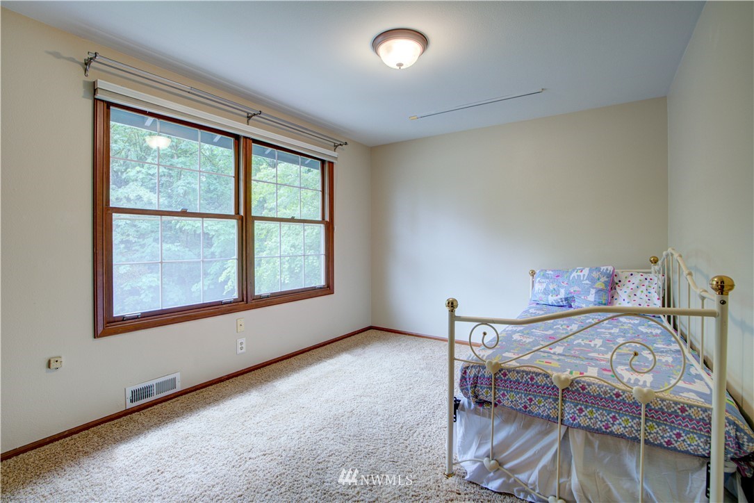 18322 Bellflower Road Bothell, WA 98012 - Photo 33 of 34 a view of a room with furniture next to a window