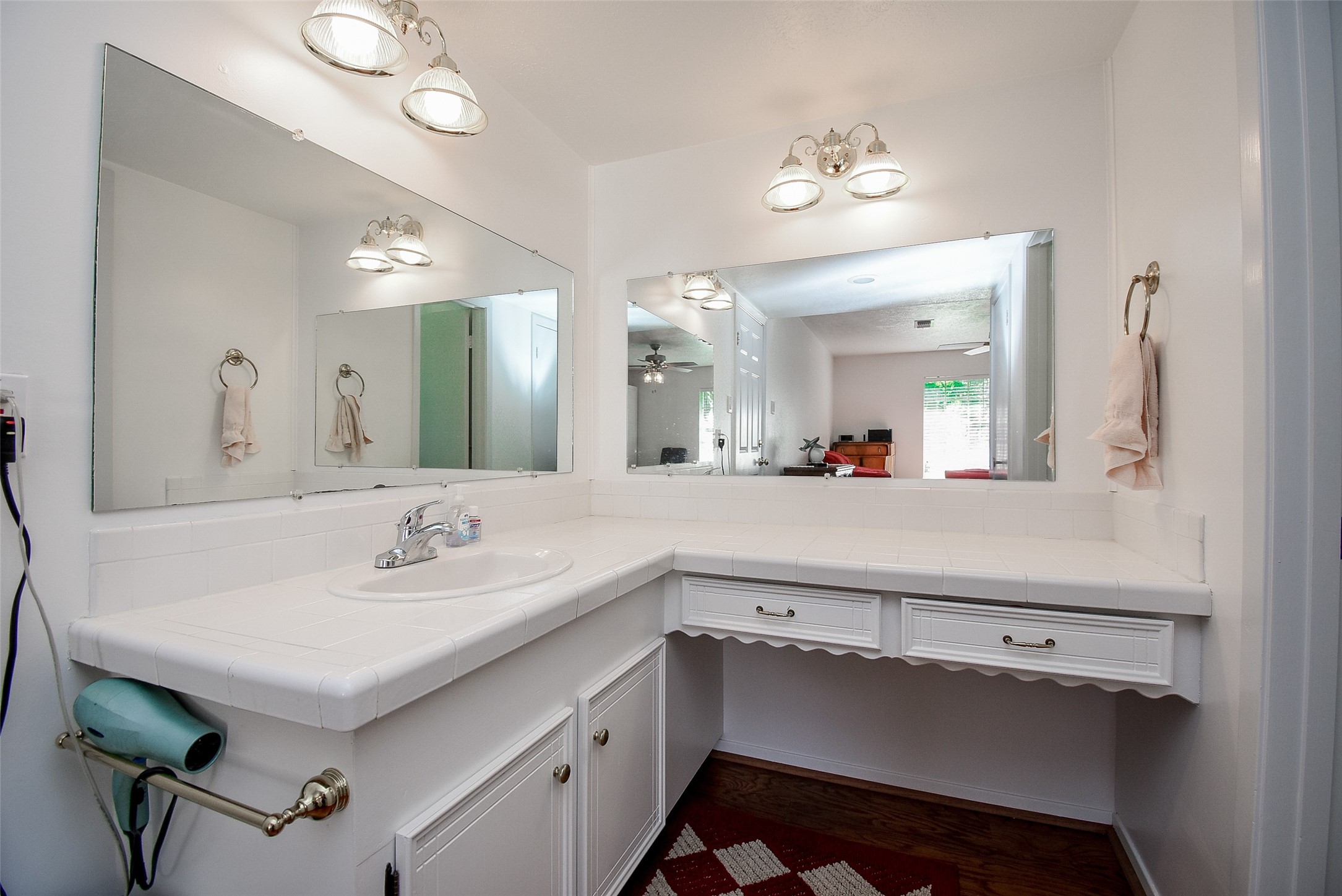 24640 Macedonia Road Hockley, TX 77447 - Photo 19 of 46 a bathroom with a sink a light fixture and a mirror