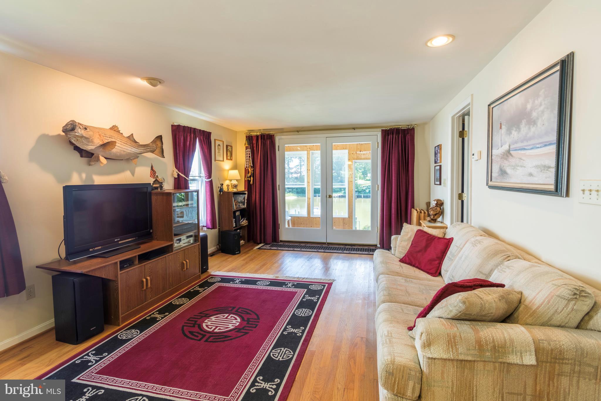 713 Red Cedar Road Annapolis, MD 21409 - Photo 8 of 30 Living Room open to kitchen and sunroom