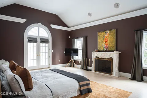 a living room with furniture a window and a chandelier