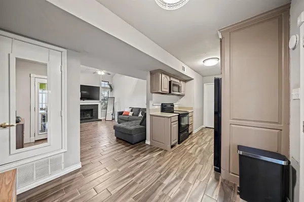 a kitchen with stainless steel appliances a refrigerator and a stove top oven