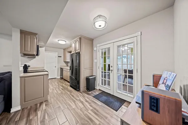 a kitchen with stainless steel appliances granite countertop a refrigerator and a stove