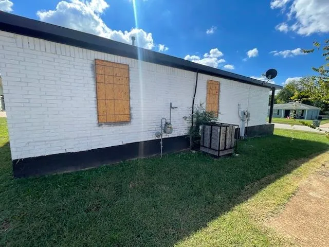 a view of backyard with a garden and deck