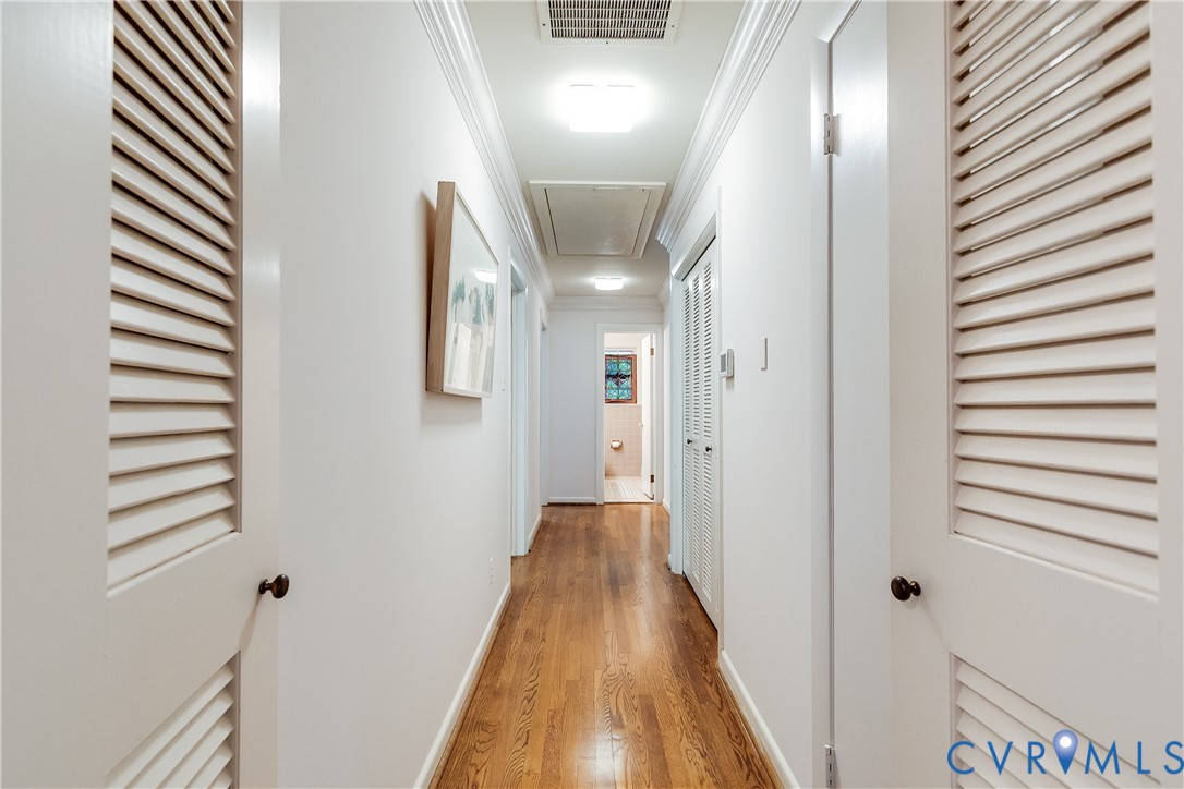 10475 Cherokee Road Richmond, VA 23235 - Photo 69 of 74 Hallway featuring hardwood flooring, white painted