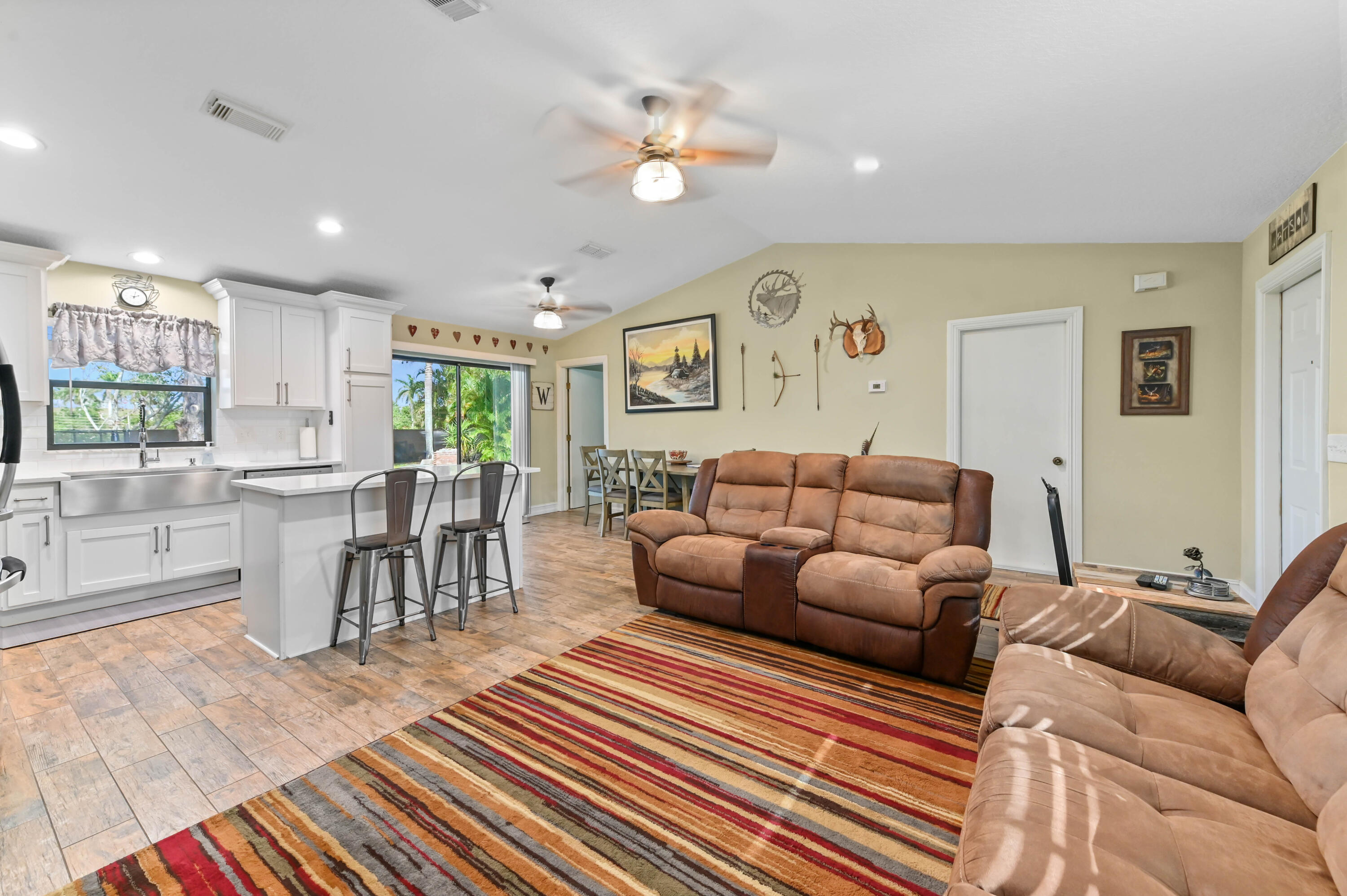 665 Southwest Backert Avenue Port St. Lucie, FL 34953 - Photo 11 of 46 a living room with furniture and a large window