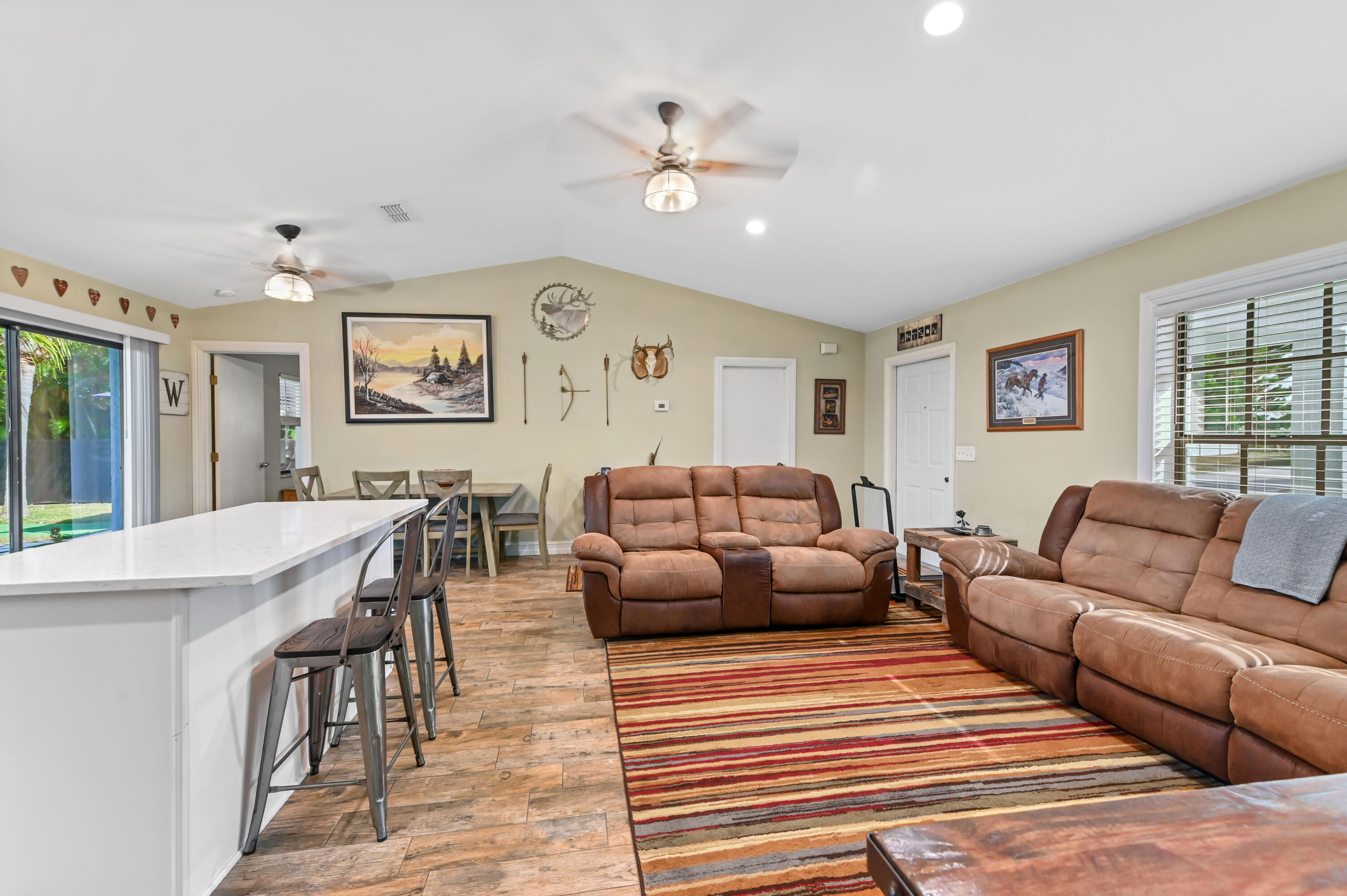665 Southwest Backert Avenue Port St. Lucie, FL 34953 - Photo 12 of 46 a living room with furniture and a large window