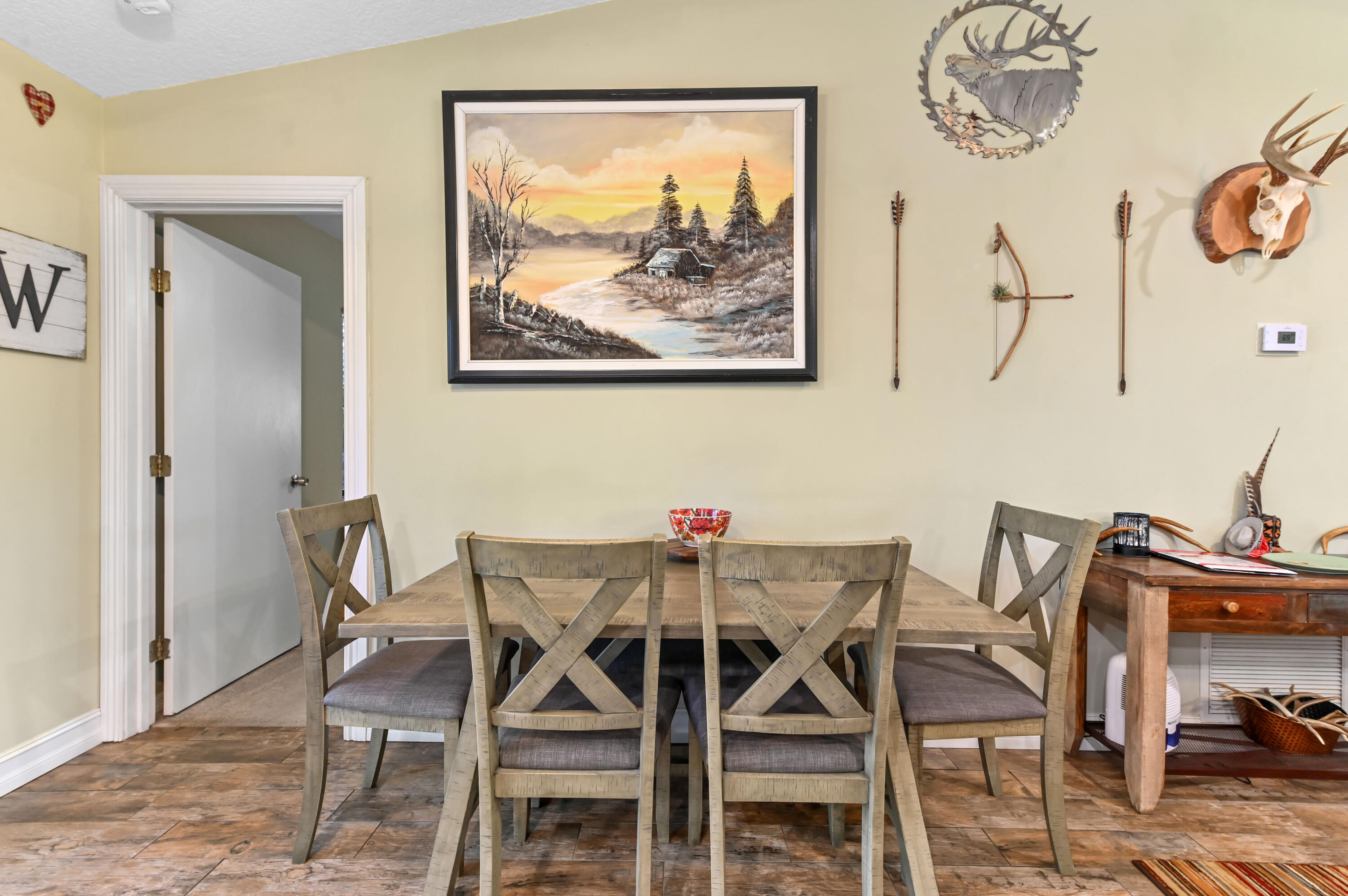 665 Southwest Backert Avenue Port St. Lucie, FL 34953 - Photo 16 of 46 a view of a dining room with furniture and wooden floor