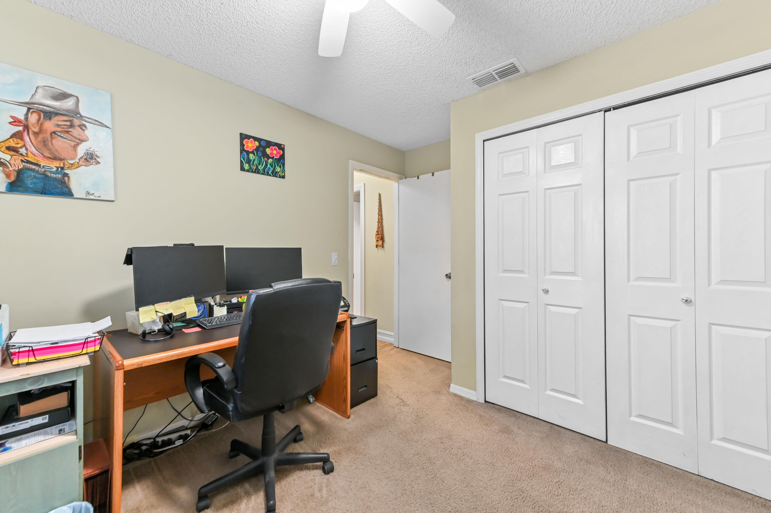 665 Southwest Backert Avenue Port St. Lucie, FL 34953 - Photo 20 of 46 a view of a workspace with furniture and a window