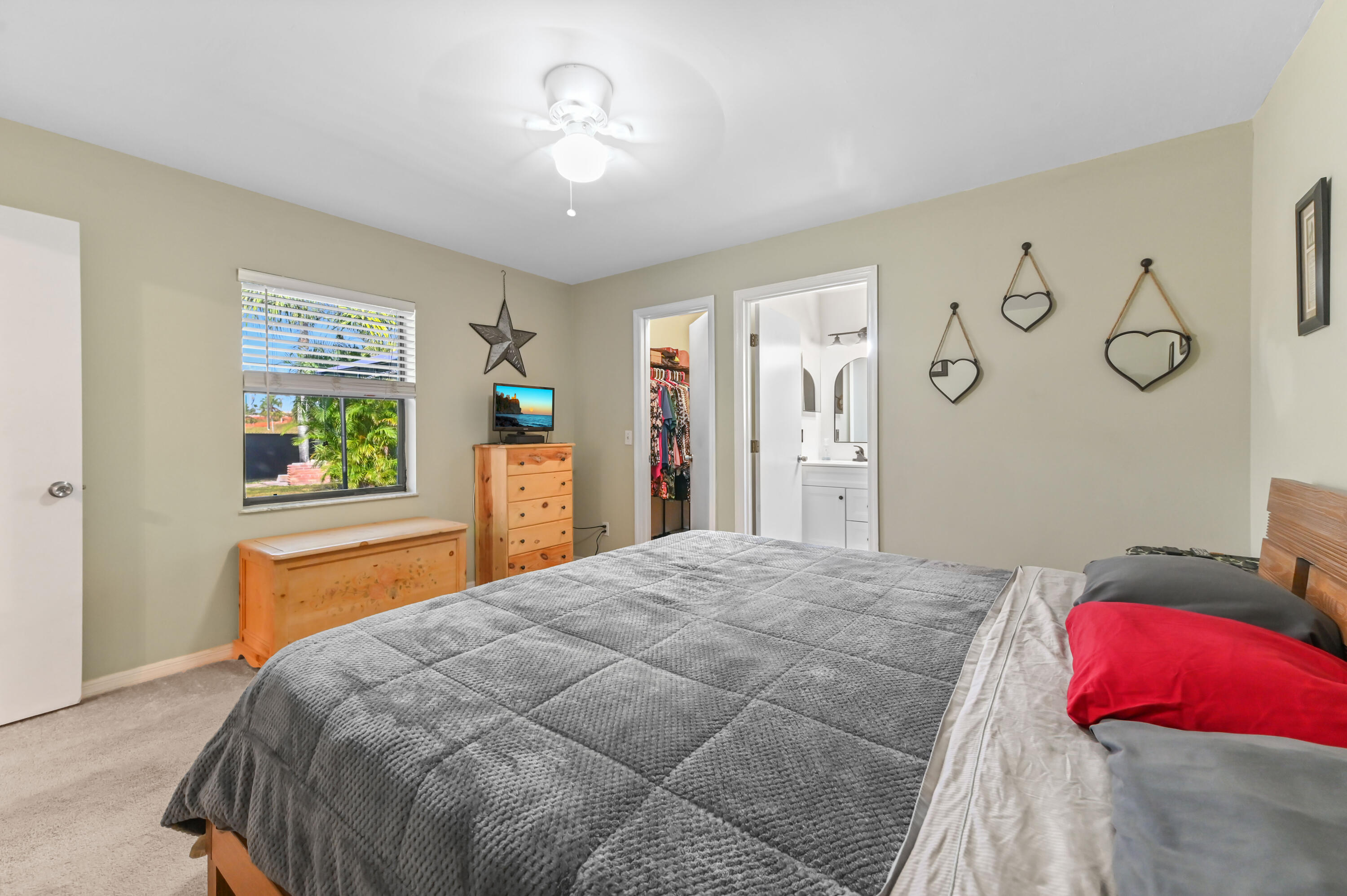 665 Southwest Backert Avenue Port St. Lucie, FL 34953 - Photo 23 of 46 a bedroom with a bed and a window