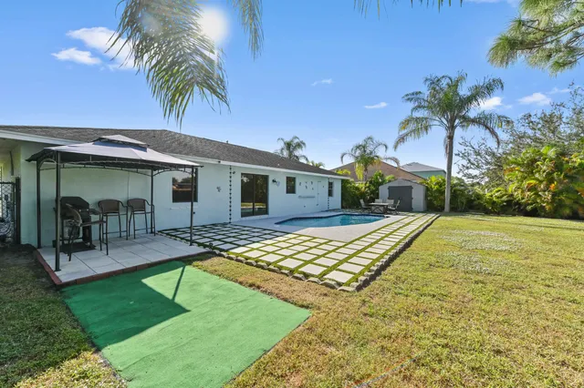 a view of a yard with furniture