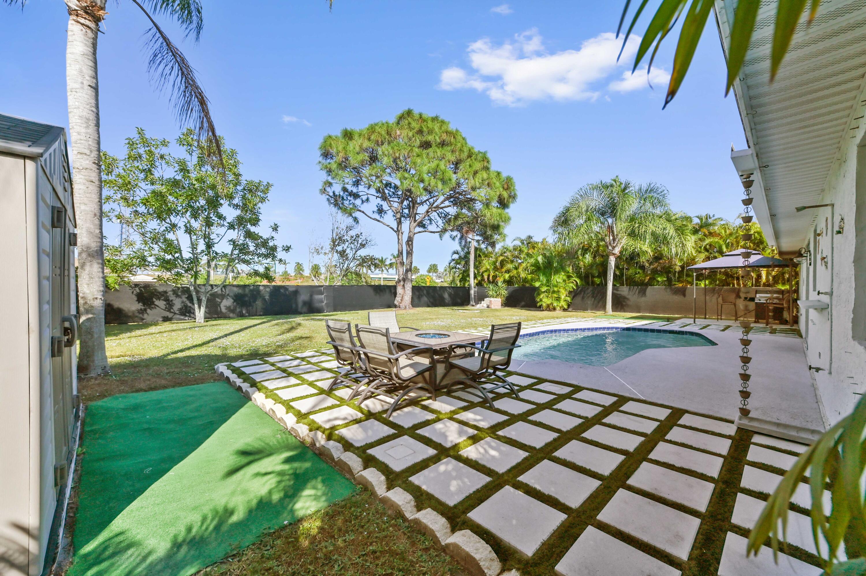 665 Southwest Backert Avenue Port St. Lucie, FL 34953 - Photo 30 of 46 a view of a yard with furniture