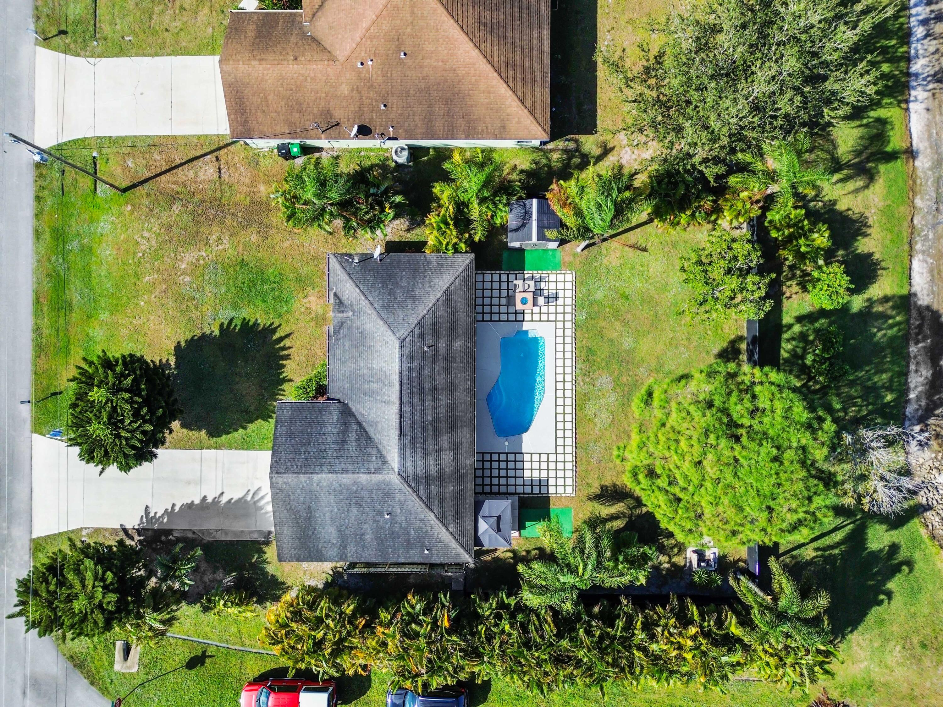 665 Southwest Backert Avenue Port St. Lucie, FL 34953 - Photo 44 of 46 an aerial view of a house with a yard and garden