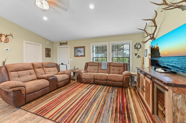 a living room with furniture and a large window