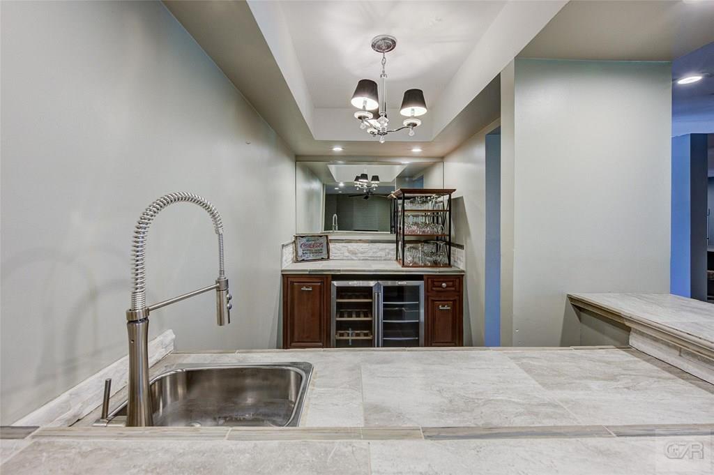 10213 Stewart Road Galveston, TX 77554 - Photo 14 of 49 a view of a hallway with a stove and kitchen view
