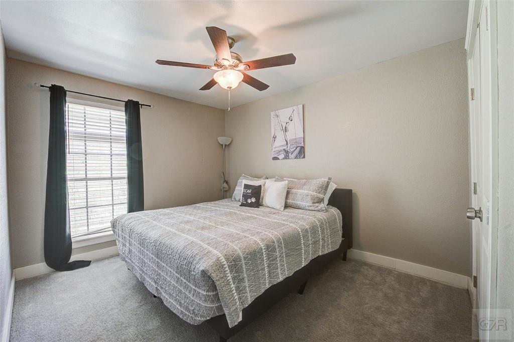 10213 Stewart Road Galveston, TX 77554 - Photo 38 of 49 a bedroom with a bed and window