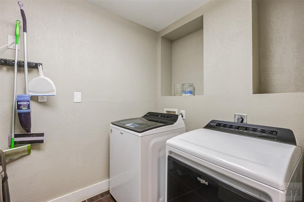 10213 Stewart Road Galveston, TX 77554 - Photo 39 of 49 a utility room with dryer and washer