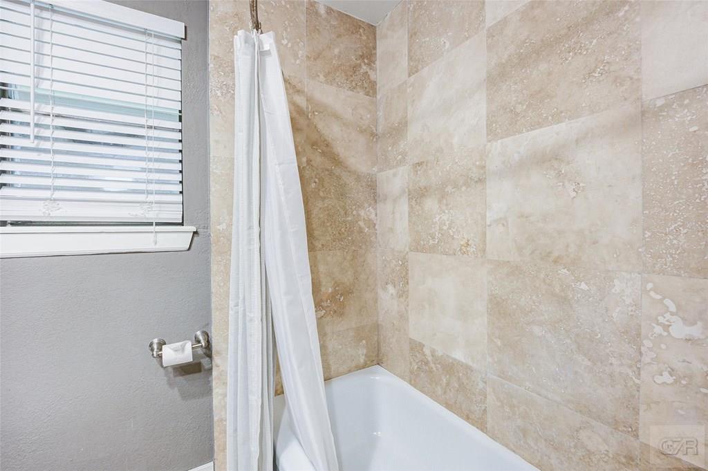 10213 Stewart Road Galveston, TX 77554 - Photo 40 of 49 a bathroom with a shower