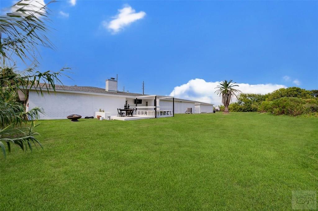 10213 Stewart Road Galveston, TX 77554 - Photo 44 of 49 a view of a house with a yard