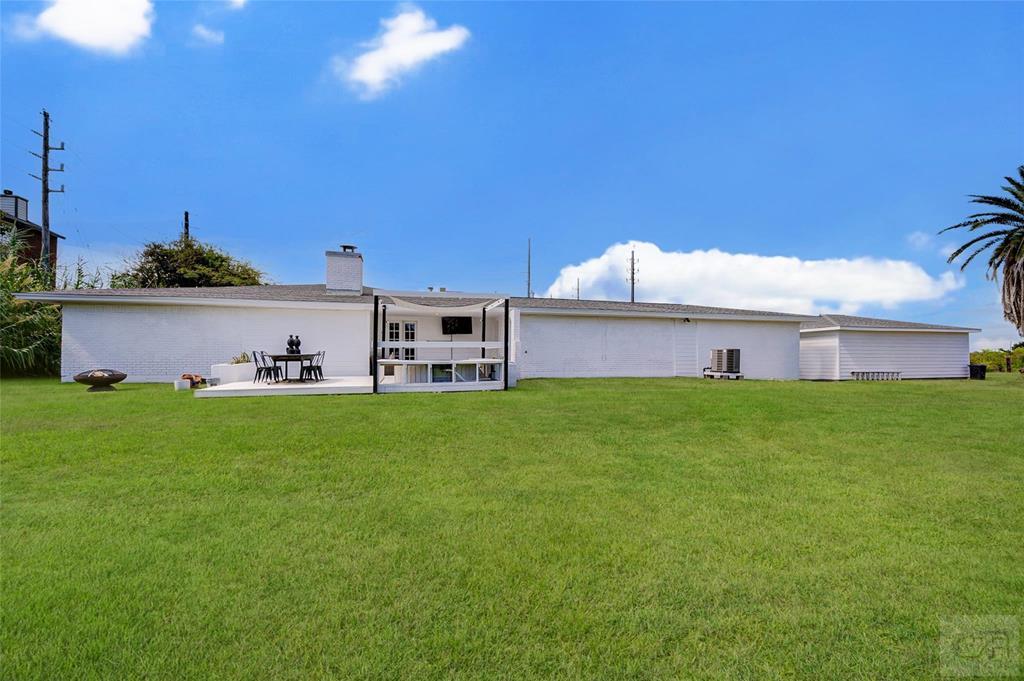 10213 Stewart Road Galveston, TX 77554 - Photo 45 of 49 a view of a house with a big yard