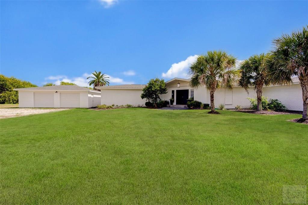 10213 Stewart Road Galveston, TX 77554 - Photo 46 of 49 a view of a house with a big yard