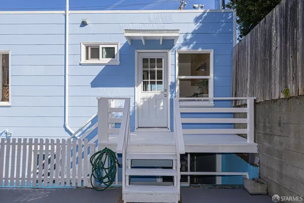 a front view of a house with entryway and stairs