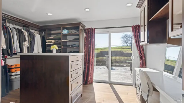 a view of a house with backyard porch and sitting area