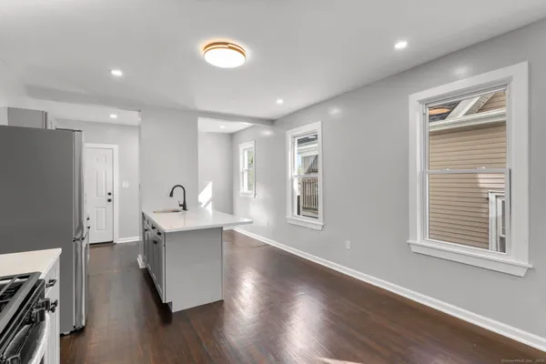 a living room with a couch and a window