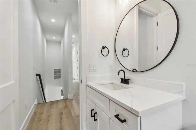 a bathroom with a sink and a mirror