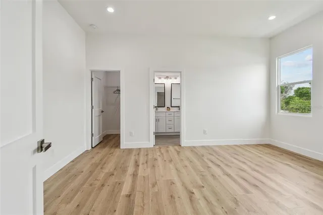 wooden floor in a room with a window