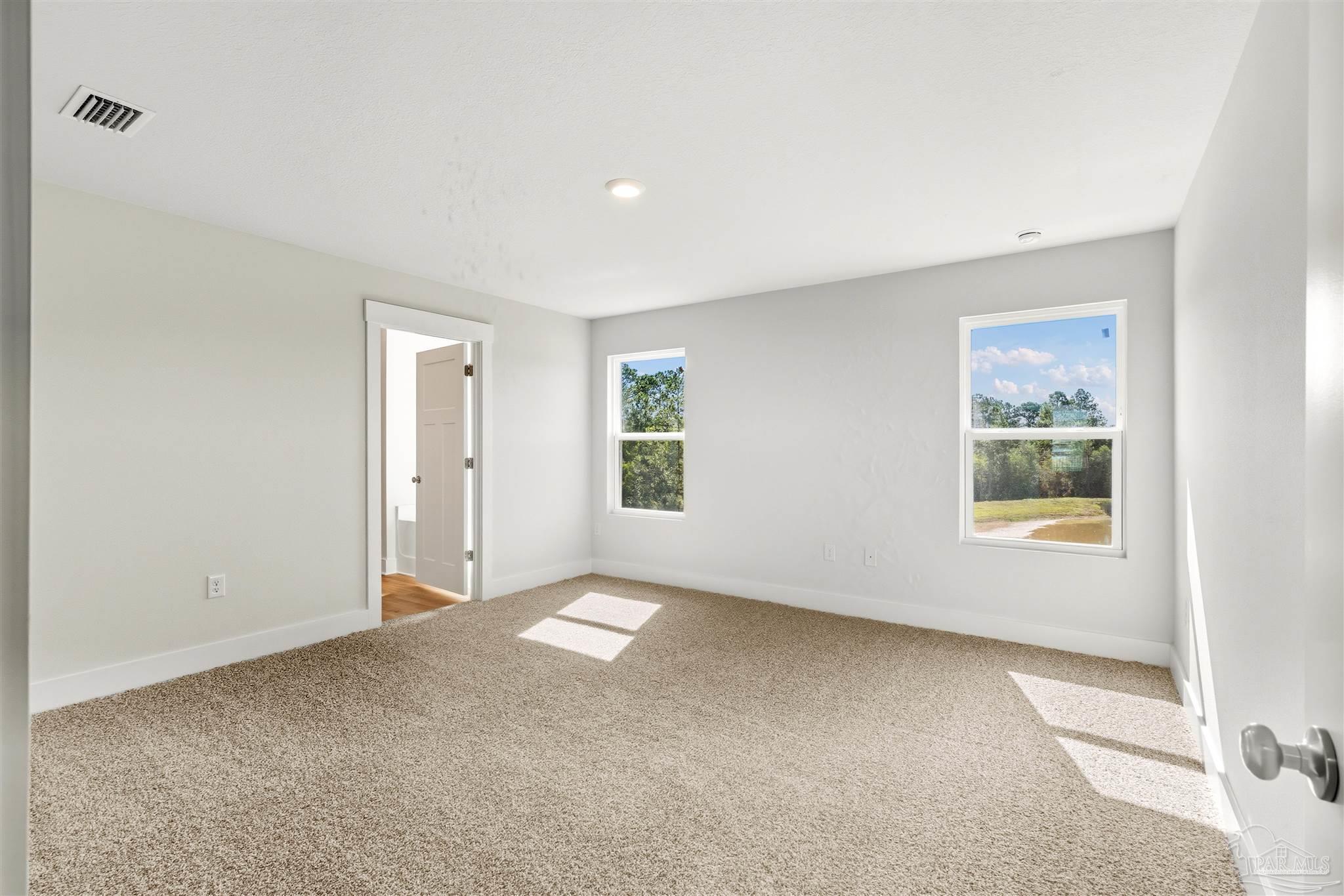 3162 Serviceberry Road Cantonment, FL 32533 - Photo 16 of 35 a view of an empty room with a window