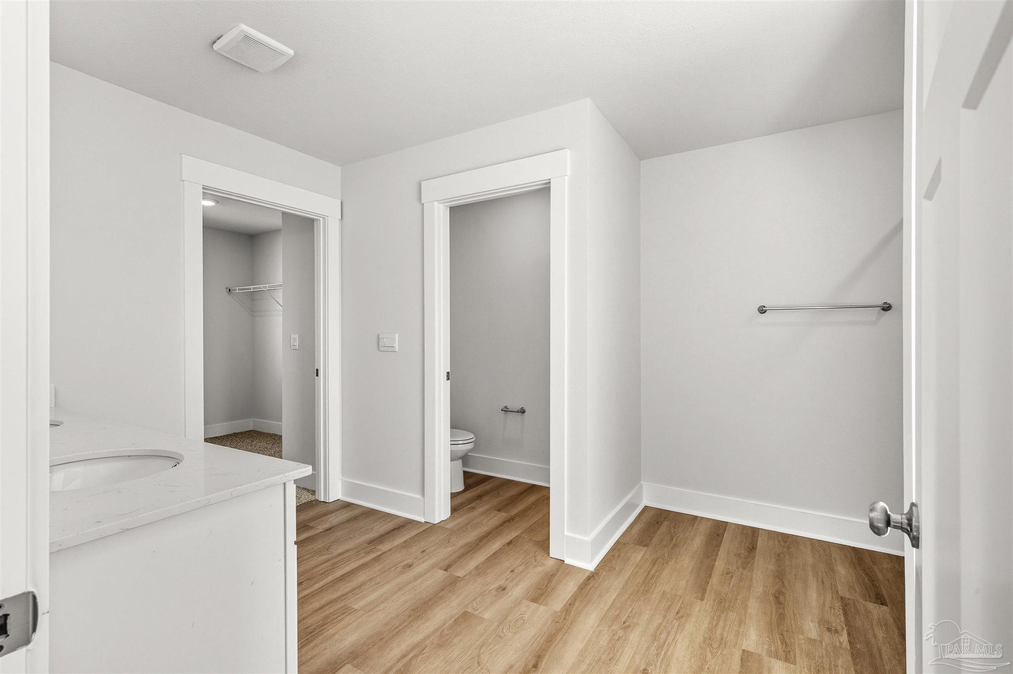 3162 Serviceberry Road Cantonment, FL 32533 - Photo 18 of 35 wooden floor in an empty room