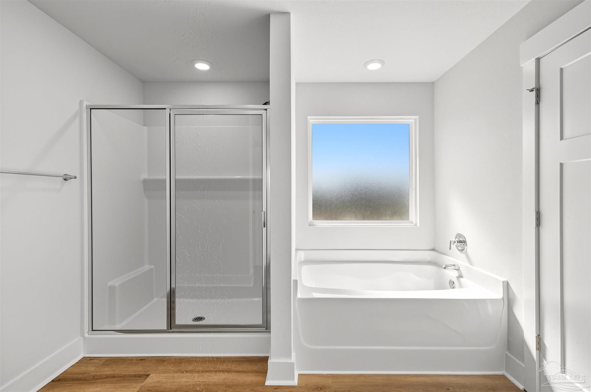 3162 Serviceberry Road Cantonment, FL 32533 - Photo 20 of 35 a bathroom with a bathtub and a shower