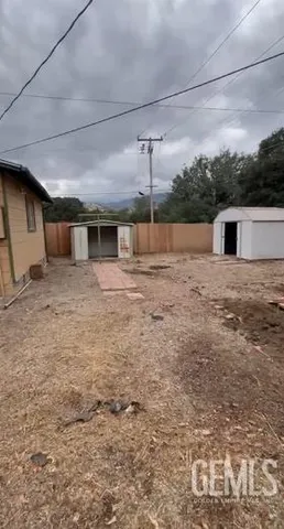 a view of a backyard of the house