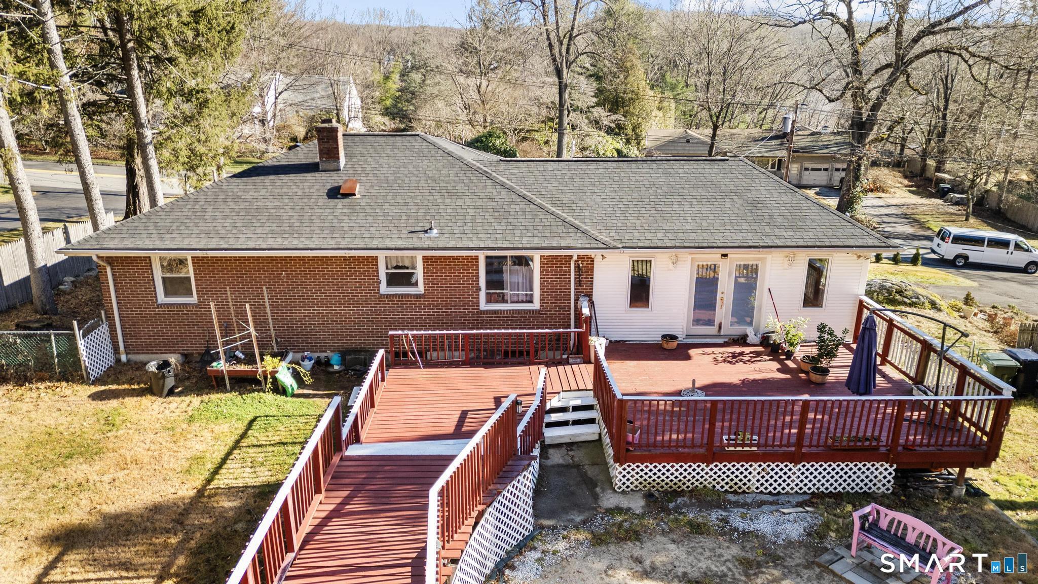 208 Bungay Road Seymour, CT 06483 - Photo 19 of 24 a view of a patio with couches chairs and a fire pit