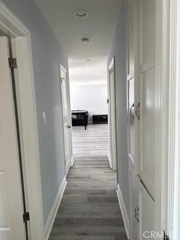 a view of gallery with wooden floor