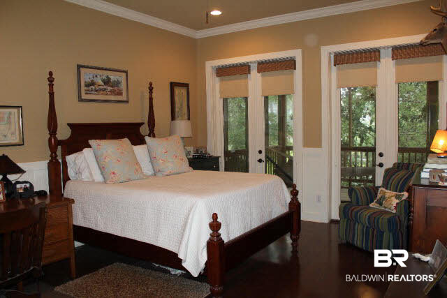 5375 Greentree Road Orange Beach, AL 36561 - Photo 9 of 25 Beautiful master suite with wood floors and French doors leading to screened porch