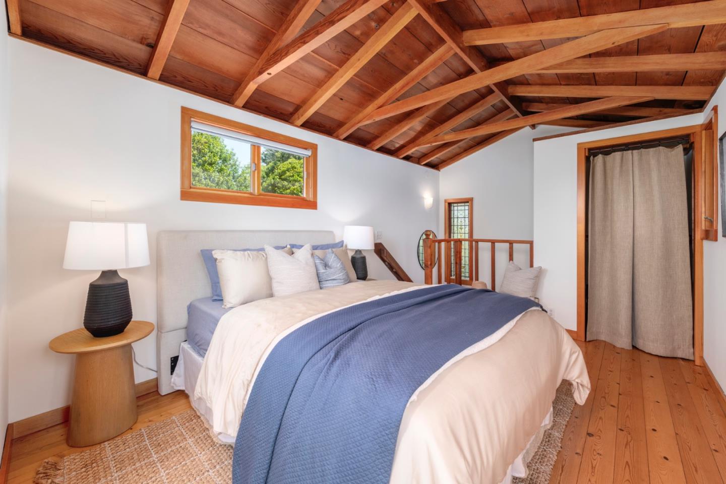 18050 Highway 1 Marshall, CA 94940 - Photo 17 of 65 a bedroom with bed and wooden floor