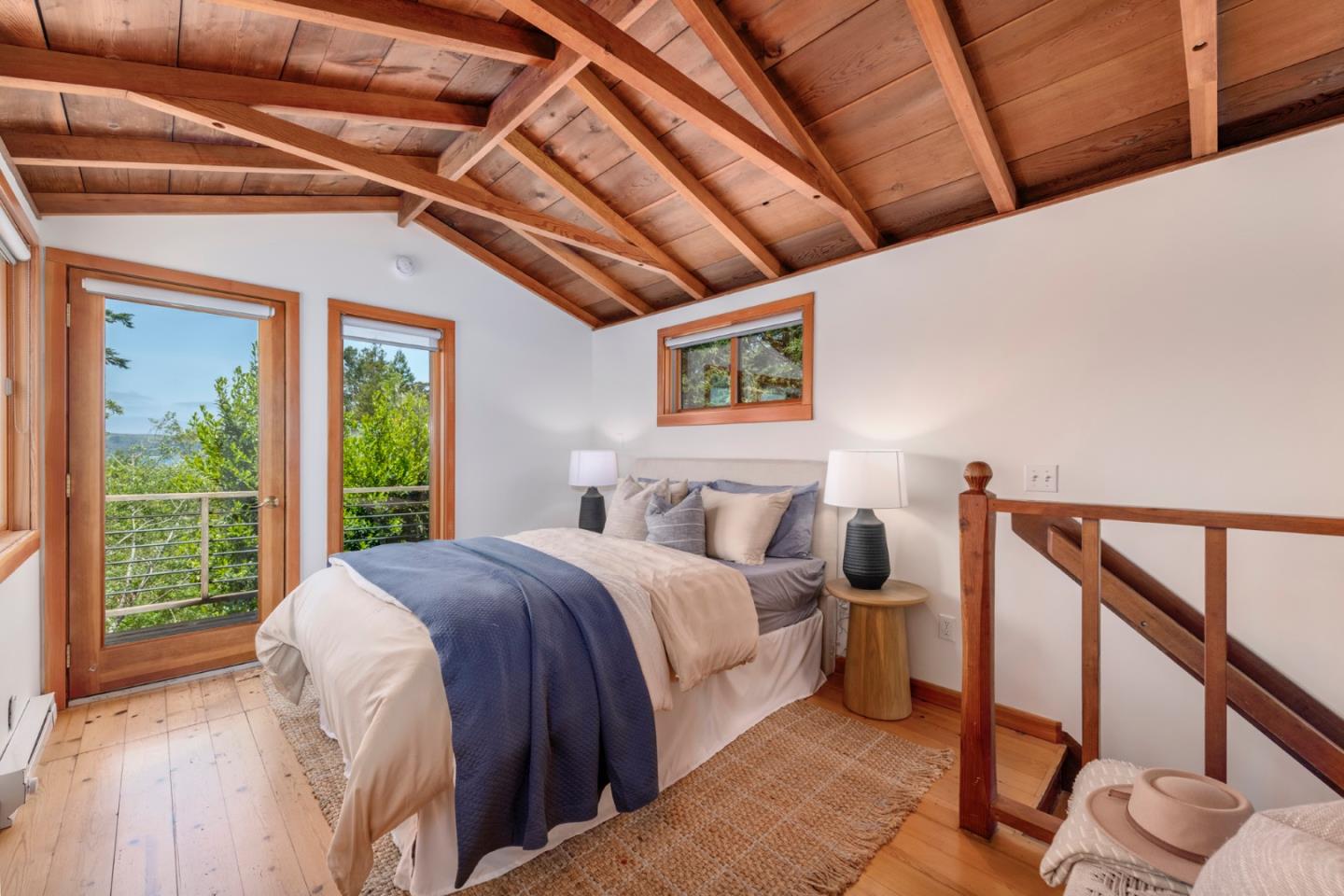 18050 Highway 1 Marshall, CA 94940 - Photo 18 of 65 a large bed sitting in a bedroom next to a window