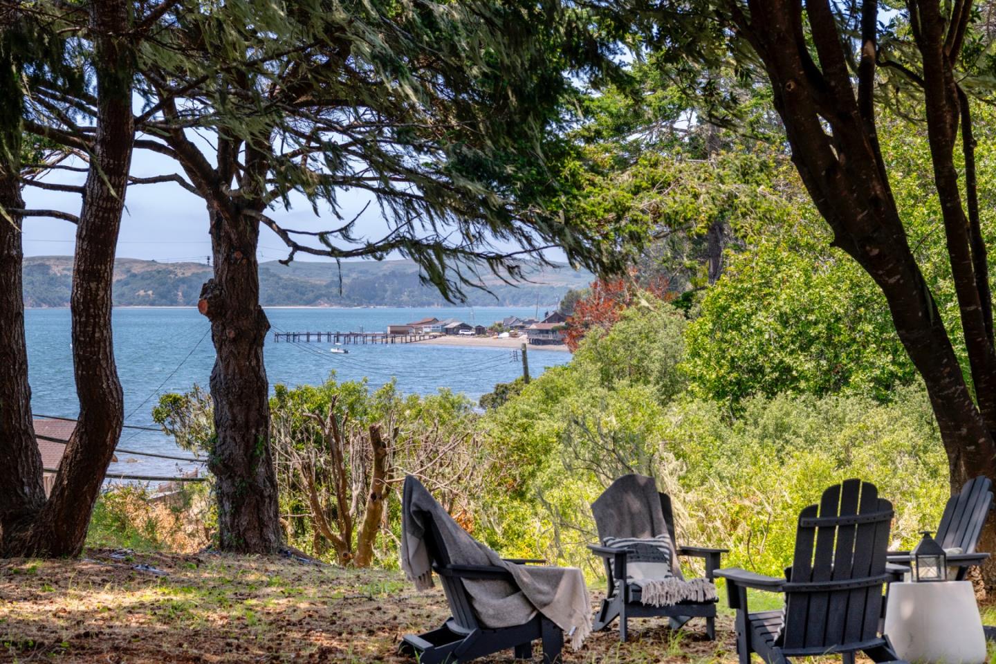 18050 Highway 1 Marshall, CA 94940 - Photo 23 of 65 a view of a porch with chairs and floor to ceiling window