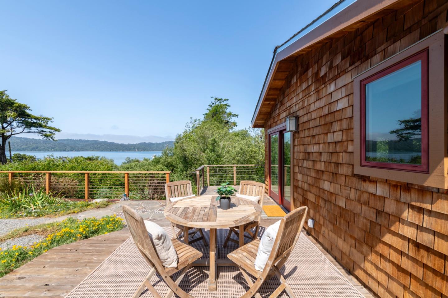 18050 Highway 1 Marshall, CA 94940 - Photo 4 of 65 a view of a patio with a table and chairs