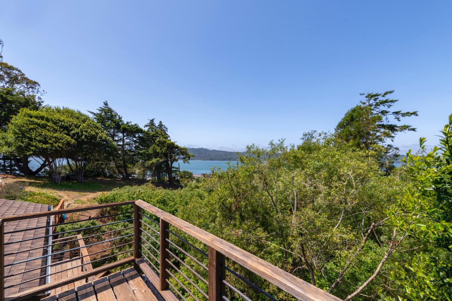 18050 Highway 1 Marshall, CA 94940 - Photo 44 of 65 a view of a balcony with wooden fence and floor