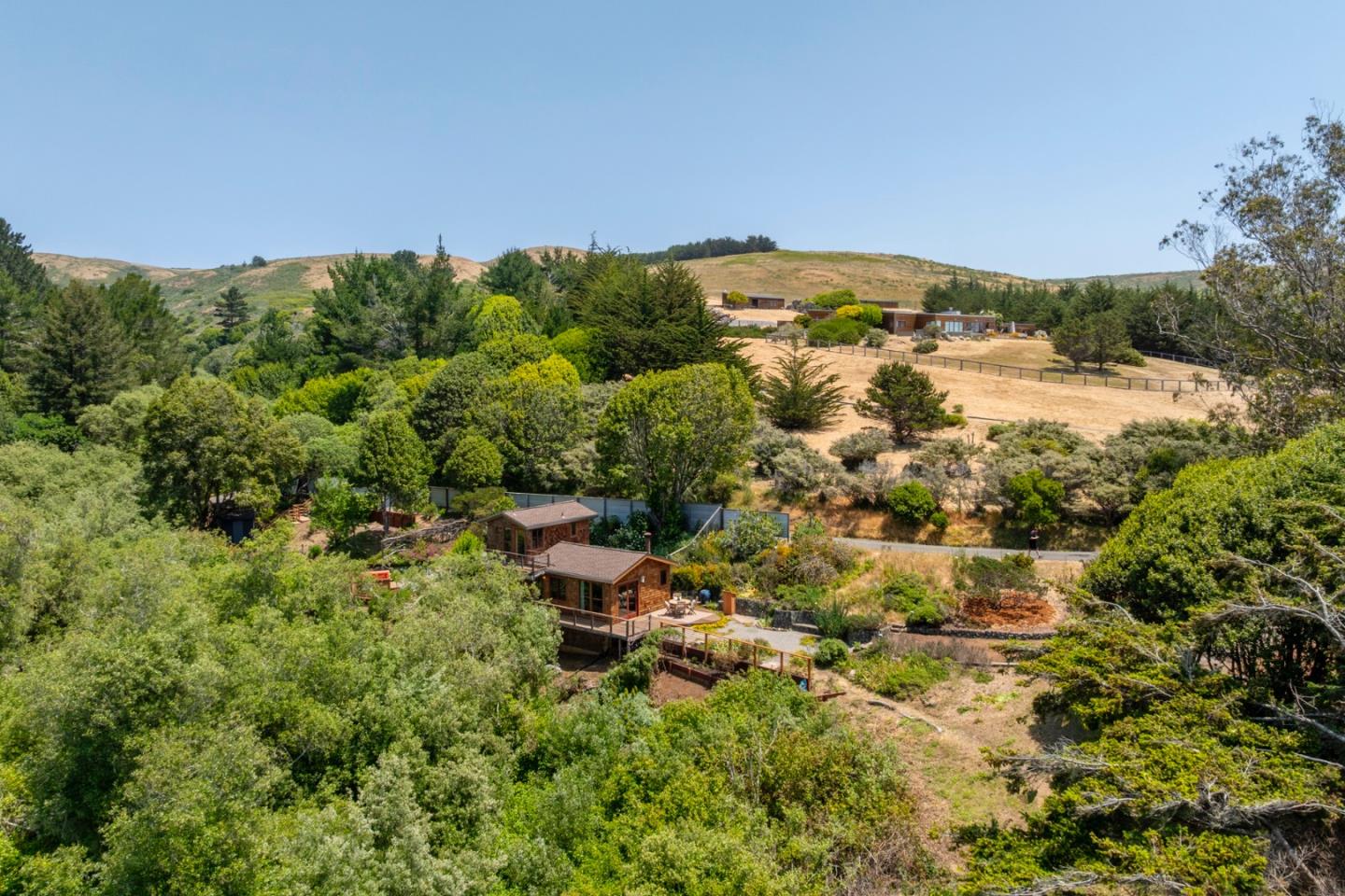 18050 Highway 1 Marshall, CA 94940 - Photo 46 of 65 an aerial view of a house with yard and outdoor seating