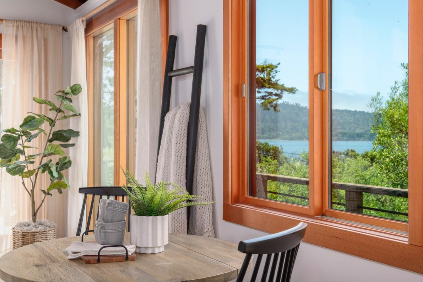 18050 Highway 1 Marshall, CA 94940 - Photo 9 of 65 a view of a living room with a potted plant and a large window