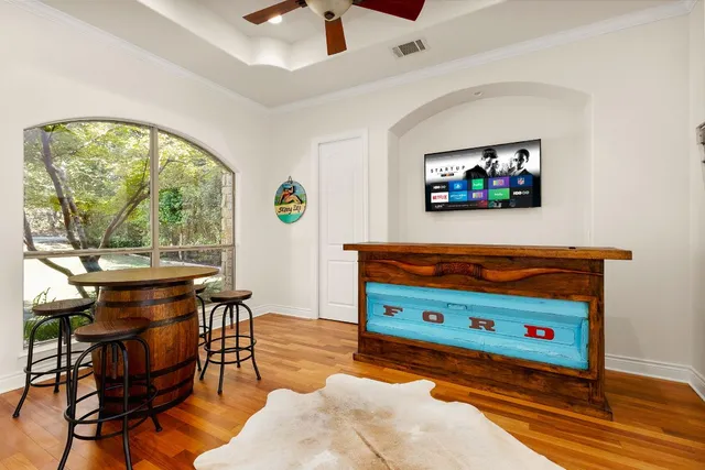 wooden room with furniture and window