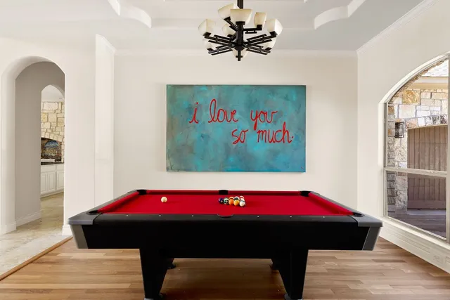 a bedroom with a bed and a table