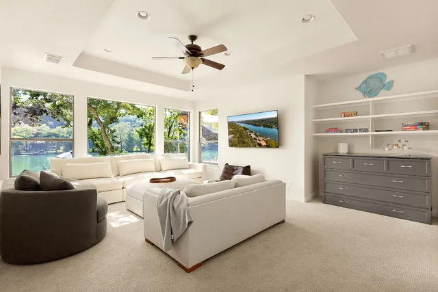 a living room with furniture and a large window