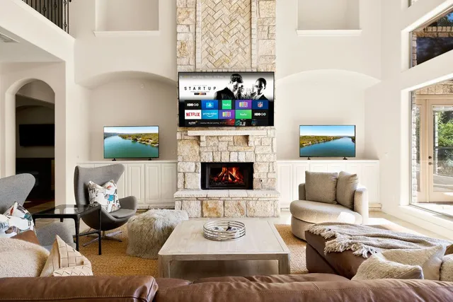 a living room with furniture and a fireplace