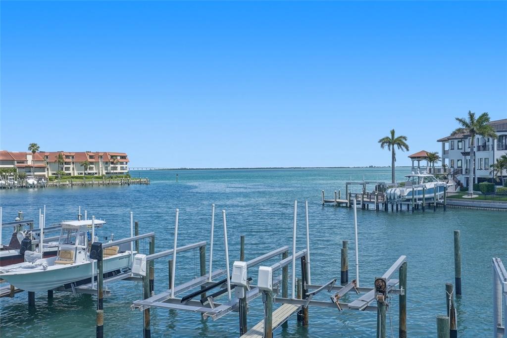 363 Pinellas Bayway South, Unit 29 Tierra Verde, FL 33715 - Photo 30 of 59 a view of a lake with outdoor seating space
